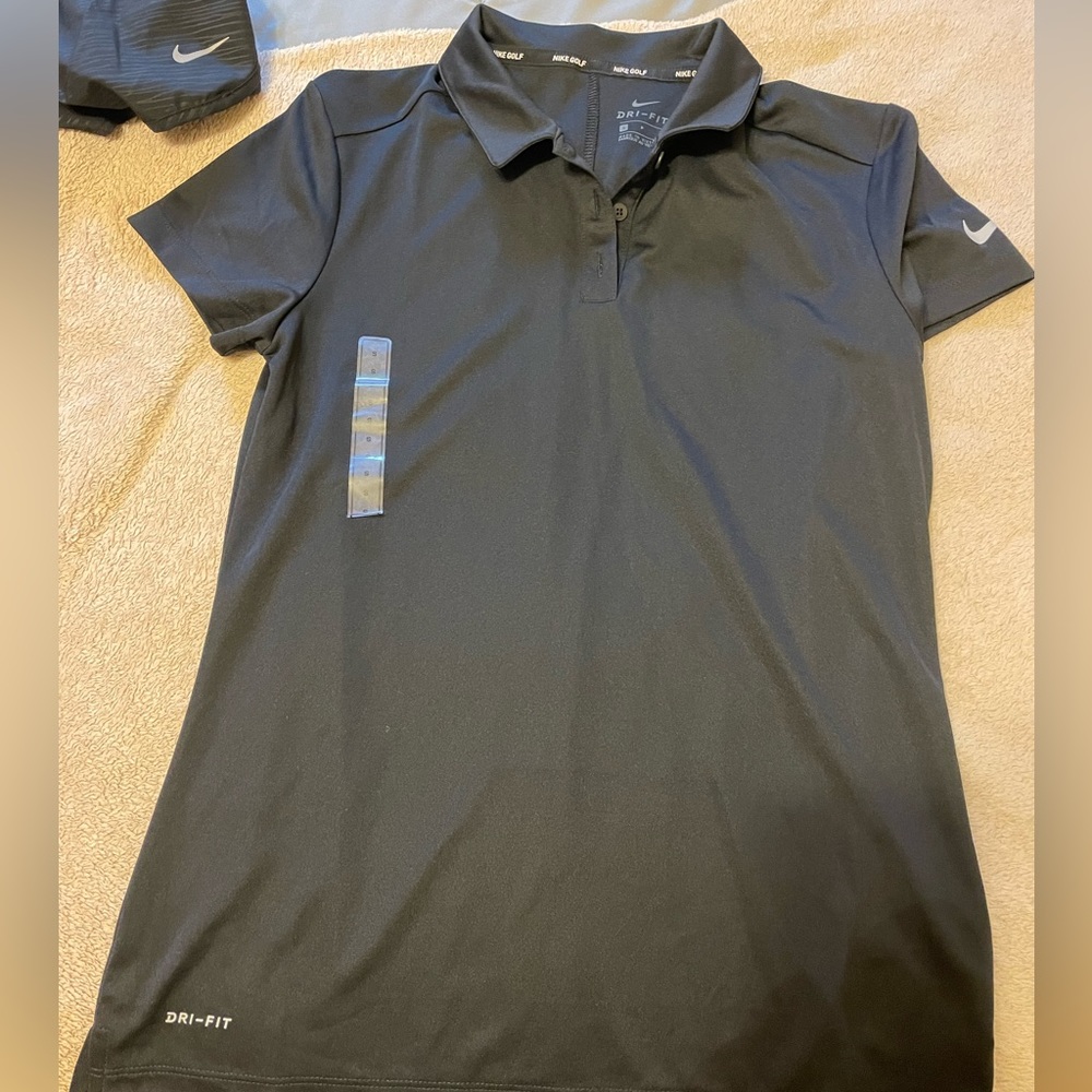 Nike golf women’s short sleeve polo shirt. Tried on, never worn. Black small
